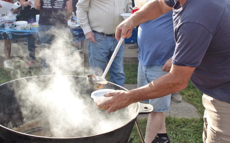 The 89th annual Weir Homecoming has become famous for their large pots of chili and beans served free to the public. The chili and beans have been served free to the public for more than 50 of those years. Stirring the pot David Jenkins served more than 150 servings to an appreciative audience.