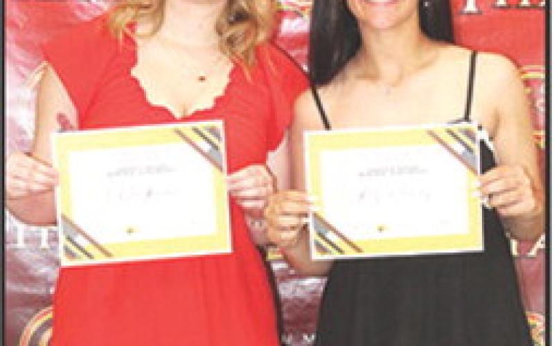 Chloe Rogers and Katy Mooney received the Sandra B. Houser Columbus Community Foundation Scholarship in the amount of $1,000 each at the Senior Assembly, May 16, in the Columbus Unified High School Gymnasium.