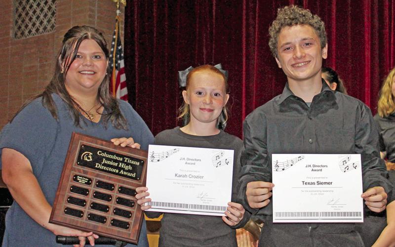 At the Columbus year end vocal music concert, Instructor Karley Jones presented the Junior High Directors Award to Karah Crozier and Texas Siemer.
