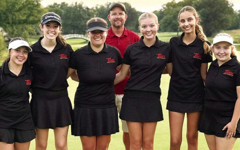 The Lady Titan Golf Team took first place in the St. Mary’s-Colgan Invitational at Crestwood Country Club, Thursday, in Pittsburg. The team won the team title by 13 strokes over their host Lady Panthers. Team members are: Hannah Noel, Natalie Wary, Fallon Smiley, Coach Jerry Smiley, Cali Carpino, Addison Johnson, and Amory Neely. Courtesy photo.