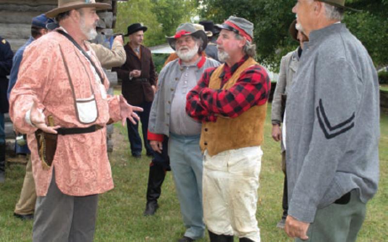 Planning the days activities the re-enactors were deciding what group would do this or that in the battle. Some of the soldiers had two uniforms so they were fighting for one side on Saturday and the other side on Sunday.
