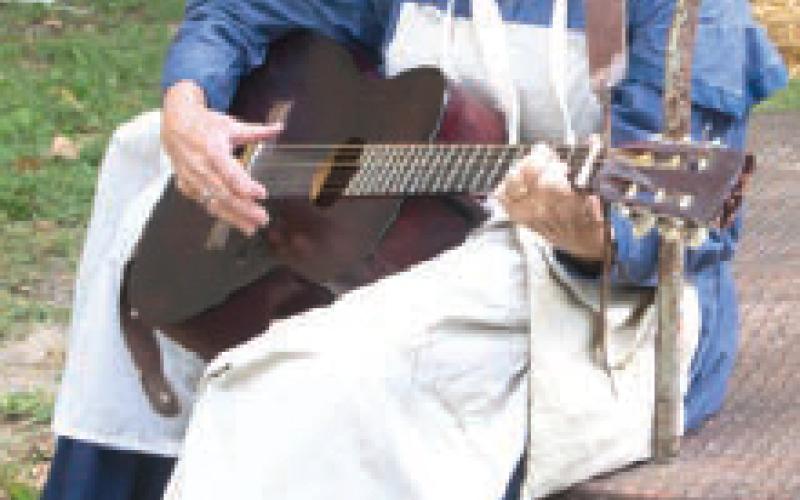 Rosalie Peterson from the Camp Followest Band provided music at the confederate camp. The Civil War re-enactment held during the Baxter Springs Fall Festival held Saturday and Sunday. Photo by Amber Helwig
