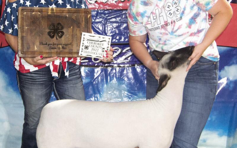 The Cherokee County Fair Grand Champion Sheep was purchased from Emma Walker, Glittering Stones, by Sally Davis for a $2,200 premium.