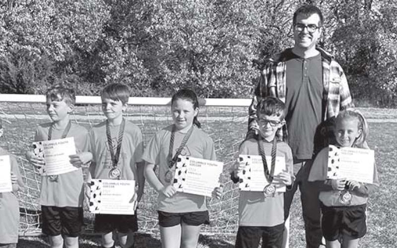Two teams tied for first place honors in the seven and eight-year-old division of Columbus Youth Soccer League. The Calibrated/Folder Express team, coached by Brian Martin and Clint Ellis received their certificates and medals during the ceremony on the final day of games in October on Froebe Fields in Eddington Park. Team members are: Ezra Crozier, Wren Ellis, Harlee Fleming, Daygin Frobish, Kannon Kitterman, Jordan Lackamp, Camden Martin, and Oakleigh Mays. Courtesy photo.