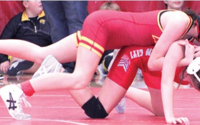 Smith wins three in junior high wrestling scramble