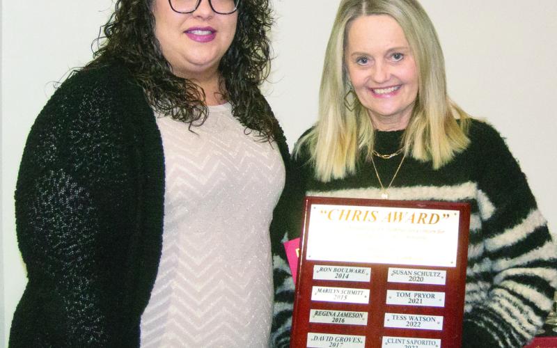 Receiving the Chris Award for her community involvement Michelle Mosler was presented by Becca DoByns. Her name will be added to the plaque and the long list of community leaders.