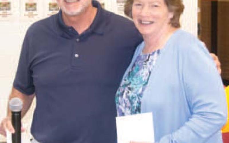 Dr. Brian Smith congratulates Linda Griffitt.