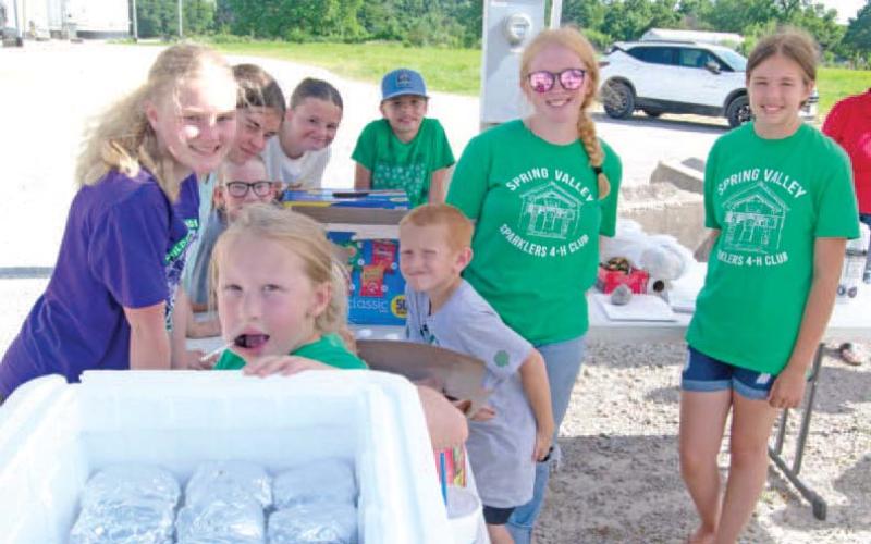 Spring Valley Sparklers 4-H’ers were busy Thursday “Feeding the Farmers” as they assisted the Columbus Chamber of Commerce in their annual salute to the local agriculture industry.
