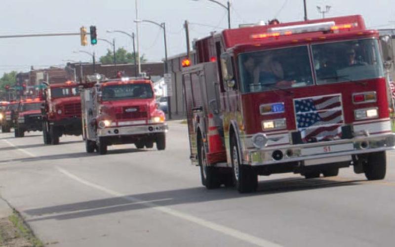 Early Saturday morning the Baxter Springs Fire Trucks formed a parade and moved down Military Avenue to their new home.