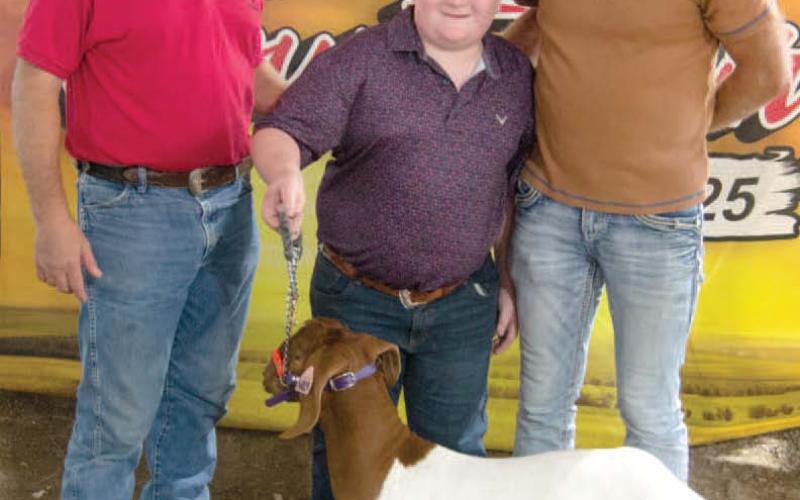 Easton Haywood, son of Kyle and Megan Haywood received a $3,000 premium bid from Draeger Farms after showing his Grand Champion Market Goat. Easton is a member of the Lone Elm Beavers 4-H Club.