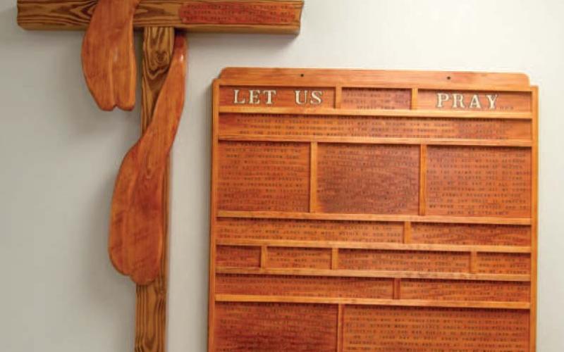 This woodwork wall hanging was made by Brad Gleason, father of Matthew and hangs in the St. Rose Parish Hall in Columbus. Gleason’s artwork was brought to the church earlier this year. “Apart from the Cross there is no other ladder by which we may get to Heaven,” a quote from St. Rose of Lima is on the cross.