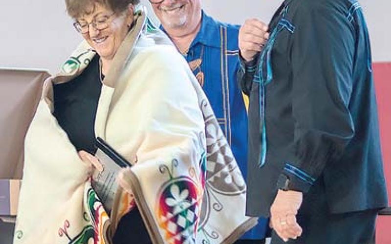 Columbus resident Kelly Carpino was awarded the tribe’s Honored Person award at the Wyandotte Nation of Oklahoma Annual Meeting recently. Presenting the award was tribe Chief Billy Friend and Second Chief Norman Hilderbrand. Photo courtesy William Swaim-Wyandotte Nation,