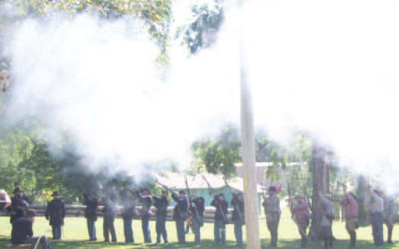 A large group of reenactors lined on the battlefield Sunday during the re-inactment.