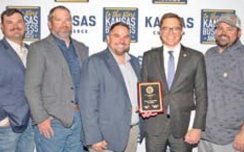 The Cherokee County Farmers Coop was recognized by the Department of Commerce as the Southeast Kansas Agribusiness Regional Award winner. Accepting the award were Paul Evans, Deven Foster, Jeff Karsten, Manager Matt Case, Lt. Governor David Towland, Josh Green and Tison Culley. Courtesy photo.