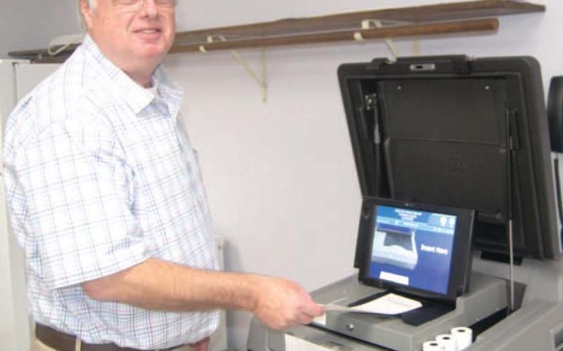Casting his vote Doug Hall was voting at the Extension Office on Tuesday afternoon. The turnout was light with 1,874 votes out of 15,601 registered.