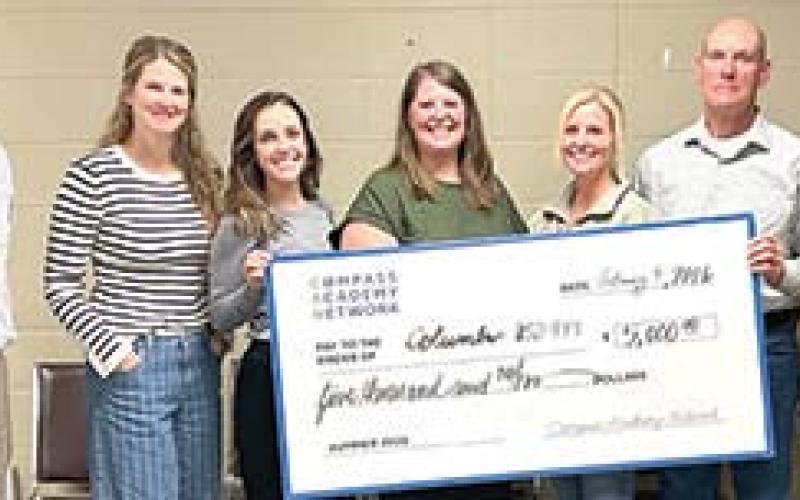 Members of the USD 493 Board of Education and Superintendent Dan Grundy were presented a Partner Grant for outstanding efforts and participation in the 2025 Compass Academy Network summer program. Courtesy photo.