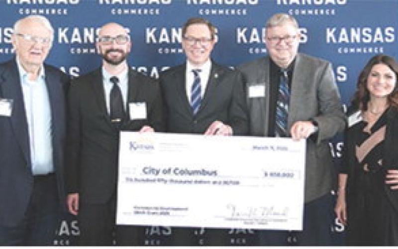 Columbus City Council member Tom Pryor, City Administrator Jake Letner, Mayor Grant Spieth were in Topeka last week to officially receive a $650,000 CDBG award. The check was presented by Lt. Gov. David Toland, and Brytonee Kepley a grants specialists with CBDG. These funds will support sewer improvements designed to reduce stormwater inflow and infiltration while enhancing the overall functionality of the system. Courtesy photo.