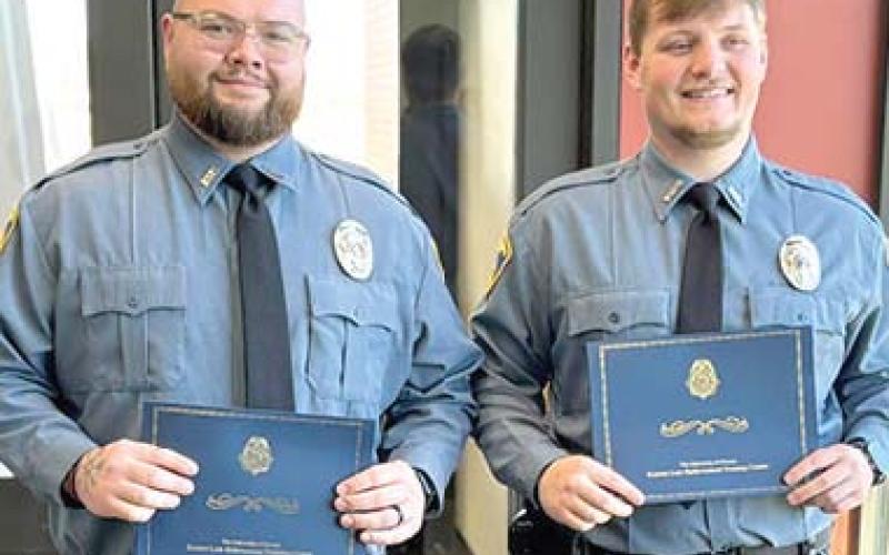 Two officers with Baxter Springs Police Department recently graduated from the police academy. Nigel Garner and Luke Gunn will now be patrolling in Baxter SprCinogusr.t esy photo.