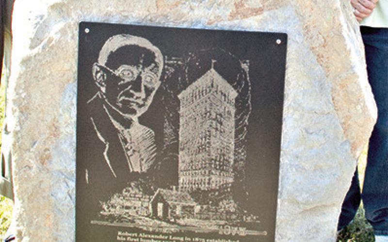 Standing silently at the corner of Kansas Avenue and Walnut Street, just a block off the Columbus Square, is a small monument in honor of RA Long.