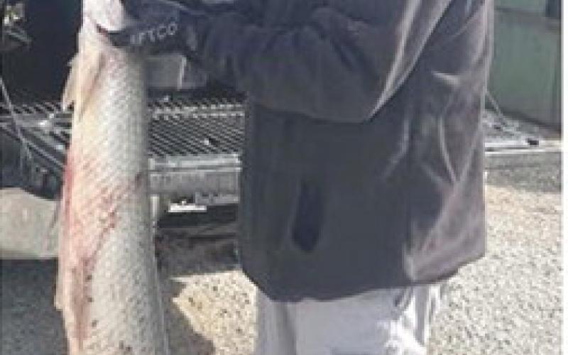 Michael Barnett of Baxter Springs landed a 33.6-pound, 63-inch-long longnose gar on April 18, 2026, while fishing the Spring River near Baxter Springs, ending a state record that stood for more than 50 years. Photo courtesy Kansas Department of Wildlife and Parks.