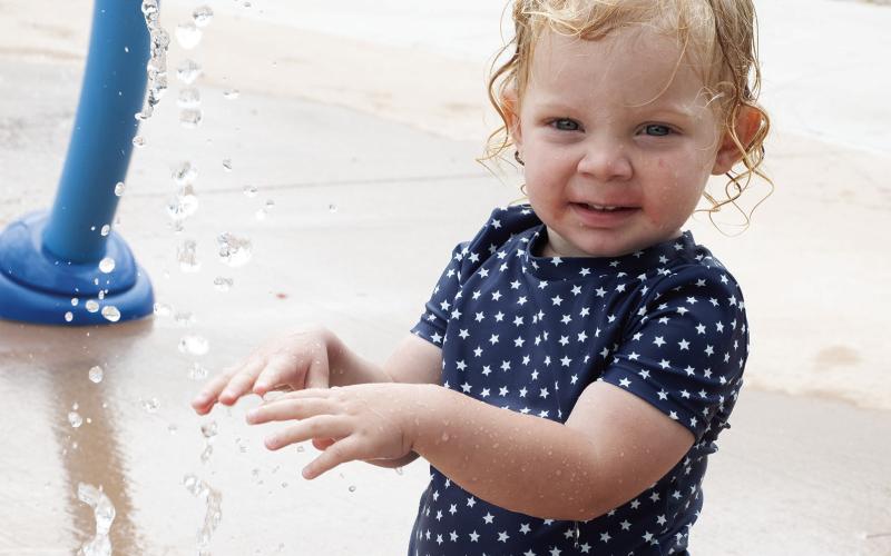 On a warm day there is no place like the Columbus splash pad for cooling off. Inola Smith was enjoying the morning with some fun in the water.