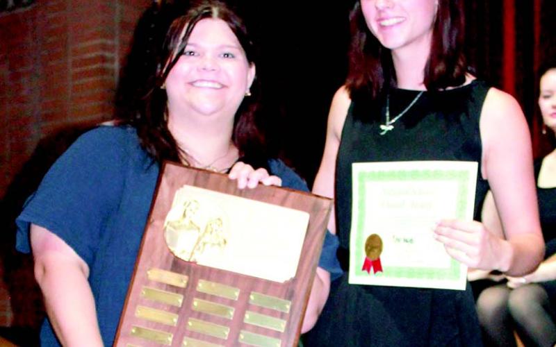 Columbus High School choir director Karley Jones presented Jacianna Heflin with the Fred Waring Di- rectors Award at the end of year vocal performance. Fred Waring was a prominent 20th-century Ameri- can musician, bandleader and choral director.