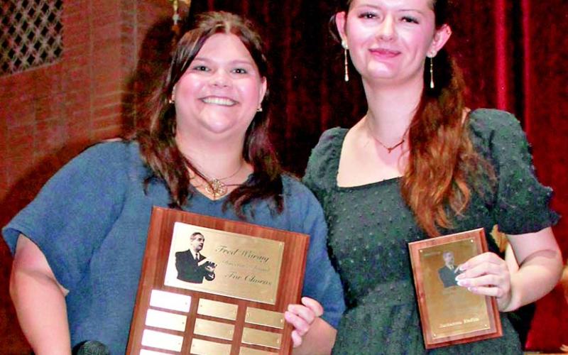 Columbus High School choir director Karley Jones presented Piper Hayes with the National School Choral Award.