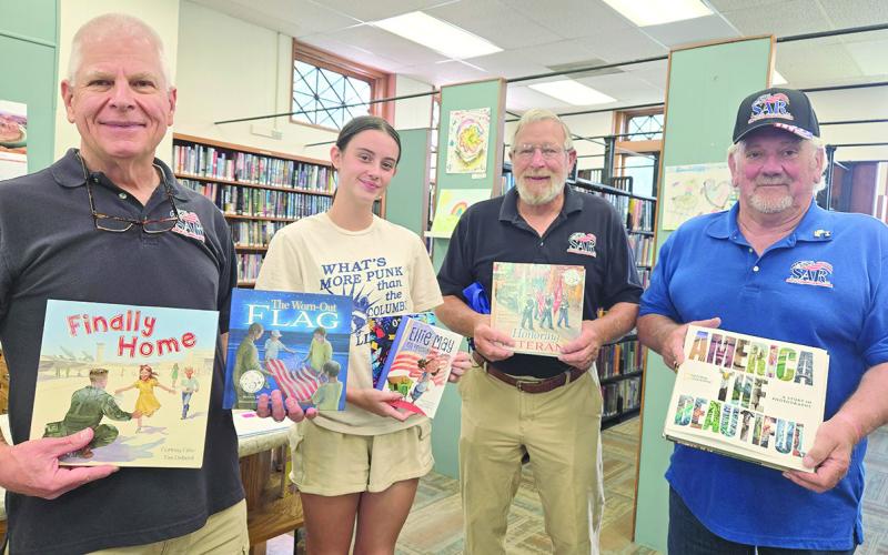 Little Balkans SAR chapter, Pittsburg donated books to the Columbus Library in honor of the America 250 celebration. The chapter is pleased to support the library and contribute to the community’s recognition of this historic milestone. Those present for the donation were Martin Dupslaff, Piper Hayes, Rick Parmele and John Gilpin. Courtesy photo.