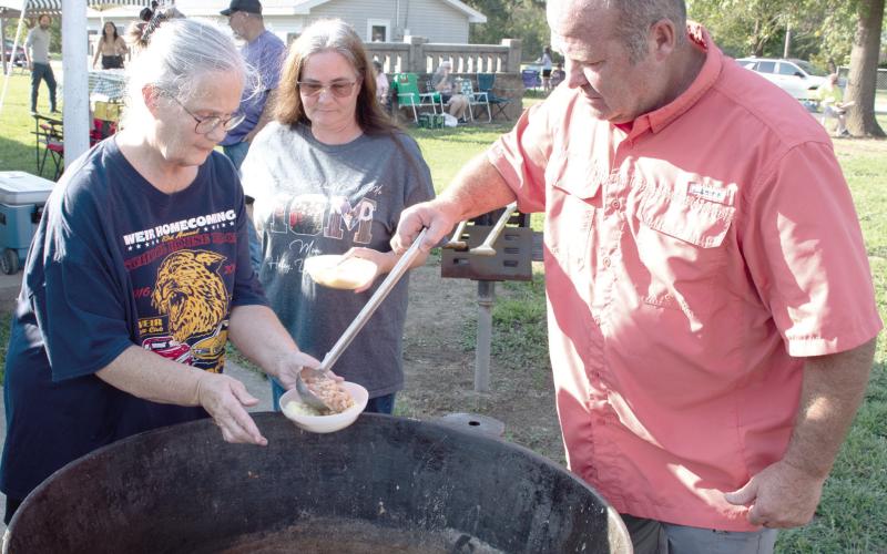 It is quite common for those attending the Annual Weir Homecoming Bean Feedto bring their own bowls. Ladies present their pre-cornbreaded bowls to be filledduring the event held in Weir September 18..