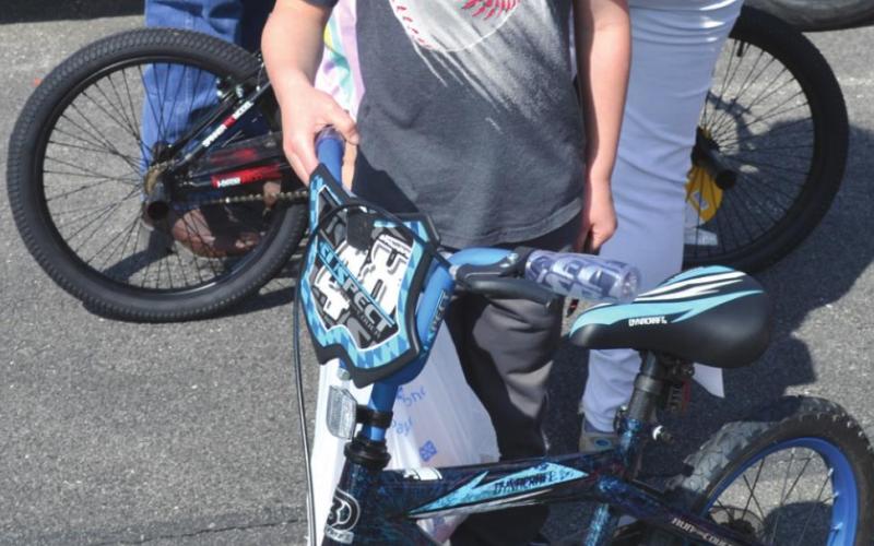 Baxter Springs Kiwanis Club gives bikes away at egg hunt