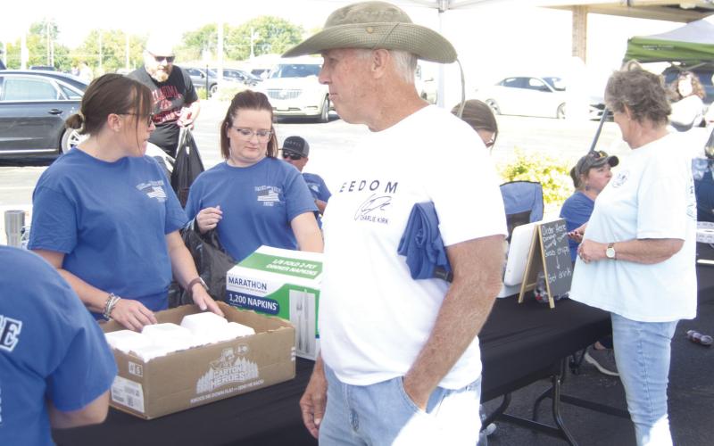 Baxter Springs Mayor Kelly Abbott waited in line for his meal at the annual Back the Badge barbecue.
