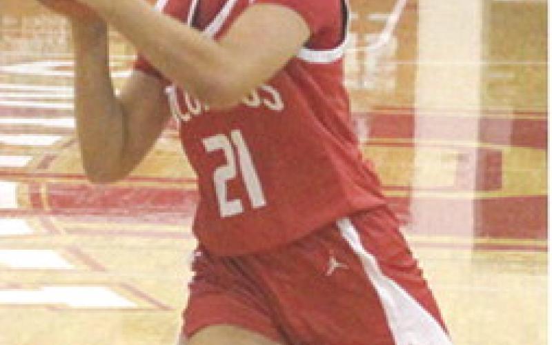 Lady Titan Sophomore, Americus Woodcock, drives to the basket in the Lady Titan, 31-28, win over Oswego, December 4. Americus scored six points in Monday’s loss at Liberal, 28-34.
