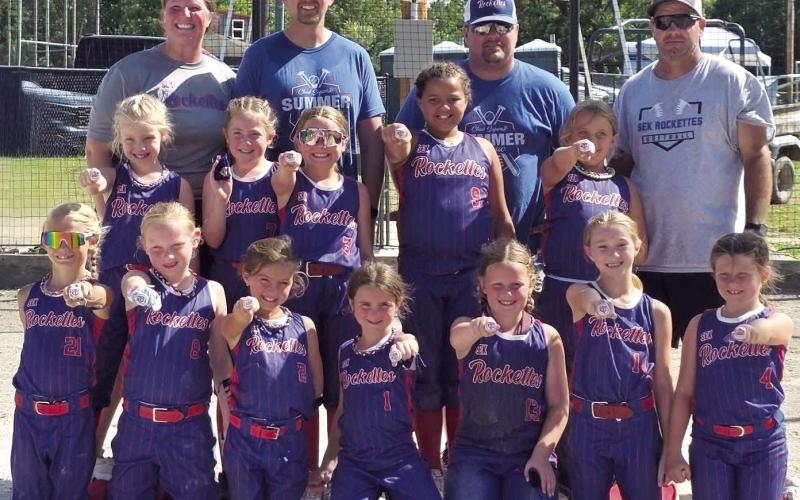 The Columbus 8U Rockettes Softball Team rallied from a game one loss to win the Chad Saporito Summer Classic Softball Tournament, Saturday and Sunday at the Community Field Ball Park. Coaches and team members are back row: Anna Moser, Lance Moser, Jeremy Gulick, and Bryan Midgett. Middle row: Amyx Evans, Rosalyn Walker, Taylynn Midgett, Aniah Palmer, and Oakleigh Mays. Front row: Renley Knopp, Jasmine Wininger, Peyton Gulick, Emersyn Carter, Morgan Moser, Kynlea Littlejohn, and Millie Ellis.