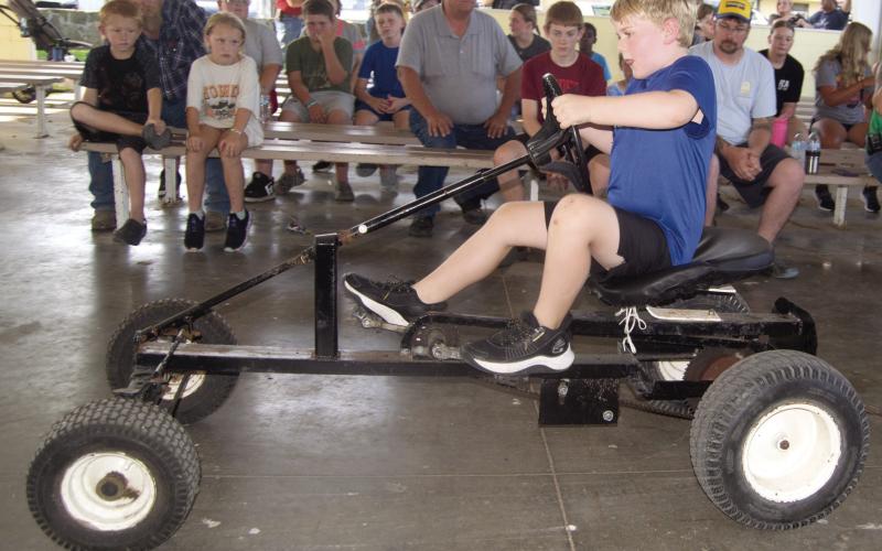 Brooks Barcus tried his skill in the Kids Tractor Pull Tuesday night of the Fair.