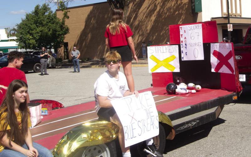 Freshmen class members at Columbus High School decorated their homecoming float with a bowling theme, “Strike the Blue Streaks.”