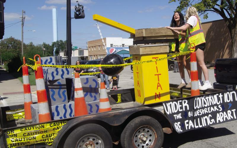 A construction theme decorated the sophomore float at the Columbus Homecoming parade.