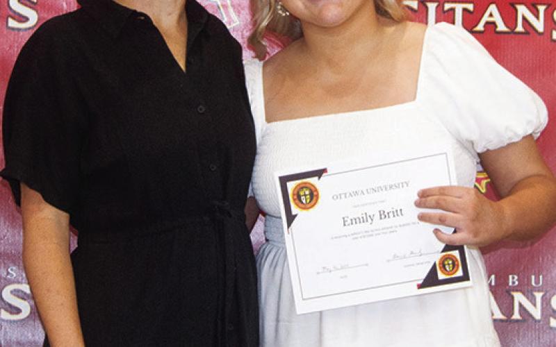 Emily Britt received a Wrestling Scholarship from Ottawa University in the amount of $72,000 during the Columbus Unified High School Senior Assembly, May 16, at the CUHS Gymnasium. The scholarship was presented by Brandy Pierce, USD 493 Instructor.