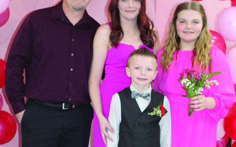 The recent elementary sweetheart dance gave families and friends of local students the opportunity to enjoy a night of music and fun. Proceeds from the event will be used for Columbus High School After Prom. The Cain family, Jacob, Jessi, Piper and Jaxon were among those attending the event.