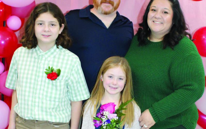 Matt and Marie Walker and their children Emerson and Rosalyn were among those attending the recent elementary sweetheart dance. Proceeds from the event will be used for Columbus High School After Prom.