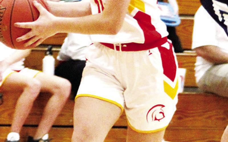 Lady Titan Seventh Grader, Americus Woodcock, drives past the Galena defender on her way to a basket in the CJHS 33-8, win over the Lady Bulldogs in the 7A game, Tuesday, at the CUHS Gym.