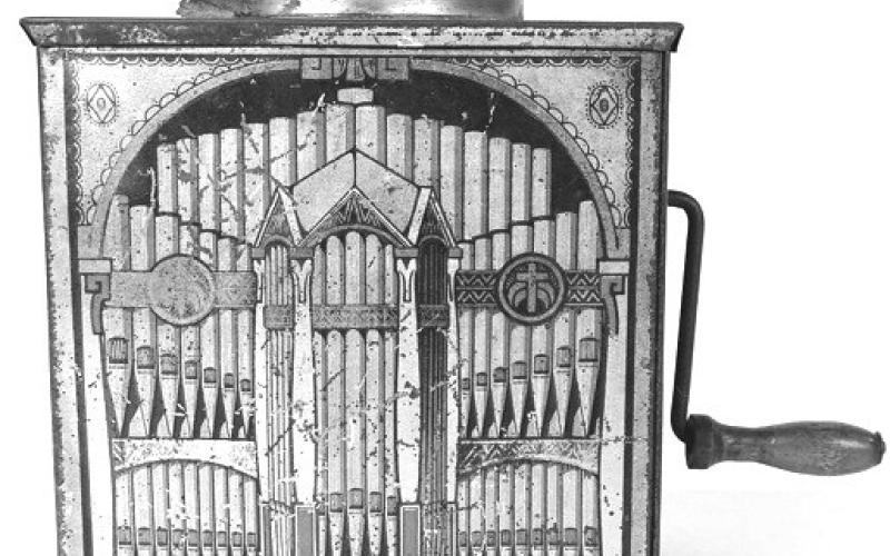 Tin lithograph music boxes like this one turned a luxury item into a simple toy. Their graphics usually featured instruments or musicians. Photo Credit: Copake Auction Inc.(c) 2026 by Cowles Syndicate Inc.