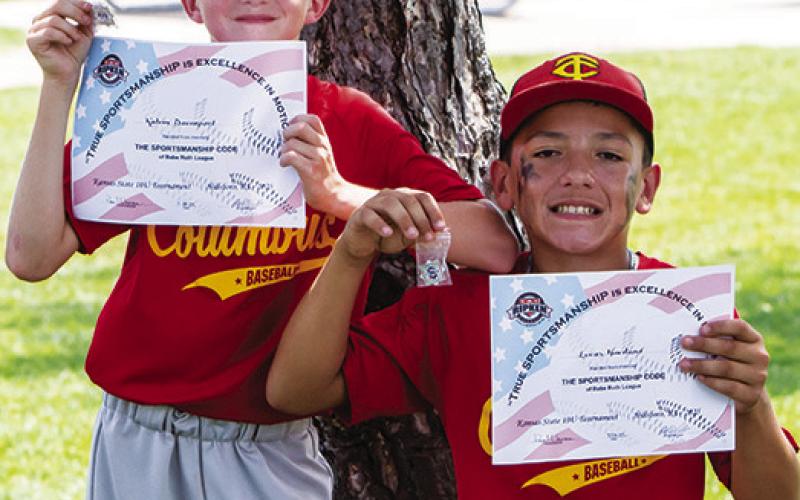 Two Columbus Cal Ripken 10U All-Stars earning their certificate and pin for memorizing the Cal Ripen/ Babe Ruth Sportsman Pledge are Kalvin Davenport and Lucas Haviland at the 10U state tournament in Hillsboro, July 16-20. The pair were also nominated for the All-Tournament Team. Photo by Kristin Sharp.