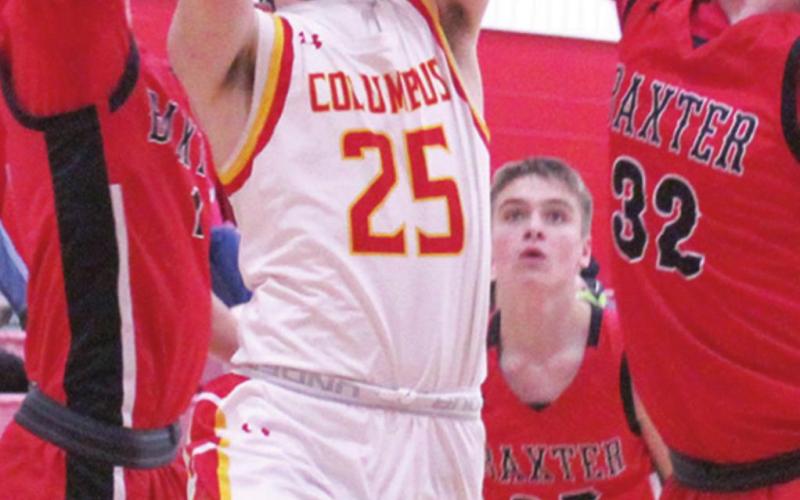 Titan Freshman, Jack Vilela, goes up for two of his team-high, 11 points in the junior varsity loss to Baxter Springs. Tuesday at the Central New Gym. Freshman, Jacob Grant, sophomore, Payton Gaines, and junior, Logan Gess defend for the Lions.