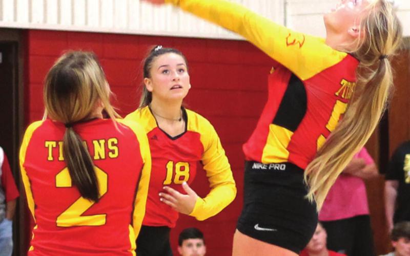 Lady Titan Senior, Lexy makes a pass during the inter-squad volleyball scrimmage before Meet the Titans, Monday nigh at the CUHS Gymnasium. Junior, Jailyn Rodriguez and freshman, Emily Britt await the result.