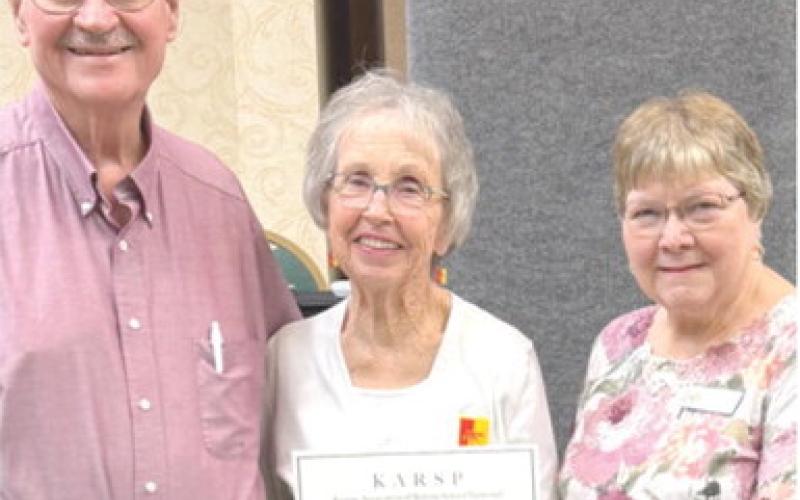 Lois and Jim Carlson, Erie, were recently recognized for their many hours of volunteer service in several community organizations over the past several years, at the 73rd Annual Kansas Association of Retired School Personnel Convention in Junction City. Presenting the award certificate was Kay Sewell, State Community Service Officer. They are members of the Chanute Area chapter of KARSP. Courtesy photo.