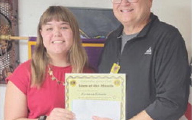 Mackenzie Richards was presented her October Lion of the Month certificate by Steve Jameson. MacKenzie is active in volleyball, is softball manager, plays clarinet in concert band. She is a member of LEO Club, Student Council and a member of National Honor Society. Courtesy photo.