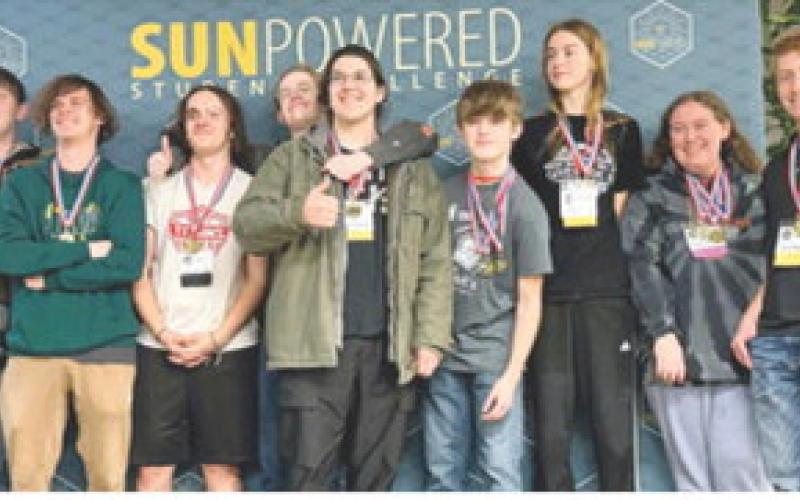 Columbus students Brenden Maxton, Kinden Riddle and Gabe Edwards were on the team that placed first in the Cooperative Challenge at the Solar Competition in Wichita in early April. Courtesy photo.