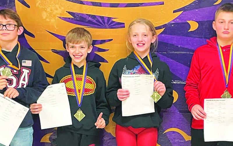 The Columbus Wrestling Club had four Mini Titans participate in the Coffeyville Kids Wrestling Tournament over the weekend. All four wrestlers brought home first place medals in their respective age and weight classes and the team championship. William Weber took first place in the 12U, 76/80 class, Lucas Natalini won the 8U, 67-pound class, Raelee Engroff placed first in the girls 10U, 82/85 class, and Carlson Britt was the first place winner in the 12U, 88-92 class. Courtesy Photo.