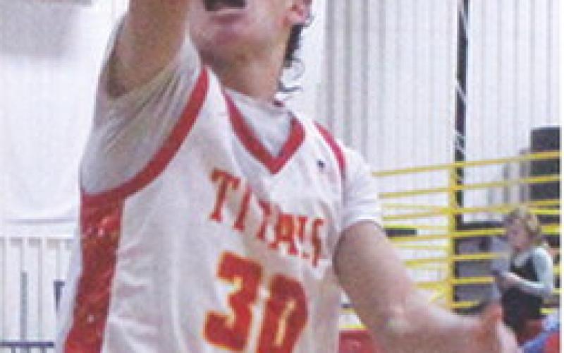 Titan Sophomore, Drake Laurance, lays in one of his multiple shots that resulted in forced turnovers by the Chargers. Drake had three consecutive layups to start the third quarter and build the Titans lead to 20 in the Tuesday win, 63-40, over Cherryvale in the CUHS Gymnasium.
