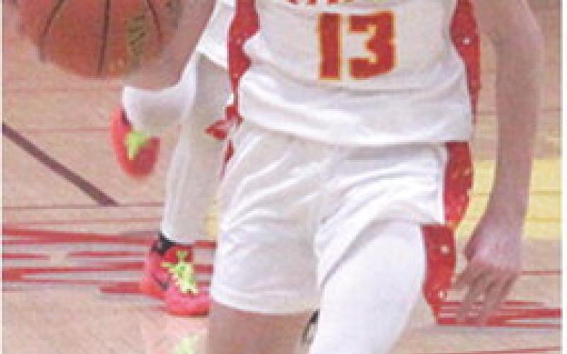 Carter Woodcock, Titan Sophomore, drives the lane for a two of his 18 points for Columbus in their 6340 win over Cherryvale, Tuesday night at the CUHS Gymnasium. Sophomore, Ethan Midgett is the trailer.